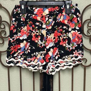 Charlotte Russe floral pull on shorts with fringe hem